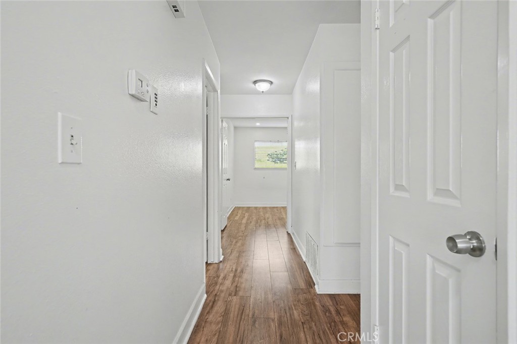 23517 Twin Spring Lane Diamond Bar, CA 91765 - Photo 18 of 40 a view of a hallway with wooden floor
