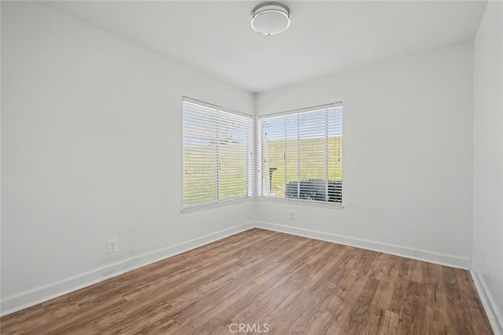 23517 Twin Spring Lane Diamond Bar, CA 91765 - Photo 22 of 40 an empty room with wooden floor and windows