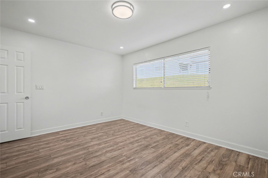 23517 Twin Spring Lane Diamond Bar, CA 91765 - Photo 27 of 40 an empty room with wooden floor and windows