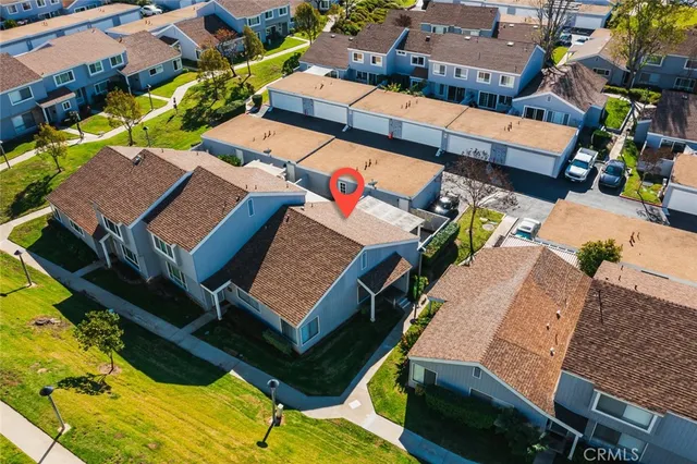 an aerial view of a houses with a terrace