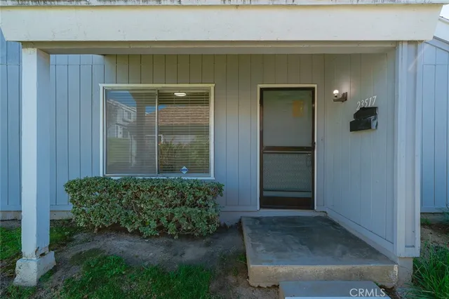 an entrance to house with yard