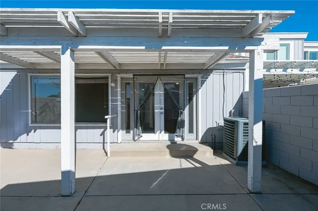 a view of lobby with glass door and furniture