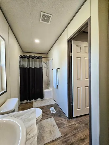 a bedroom with a bed and a walk in closet