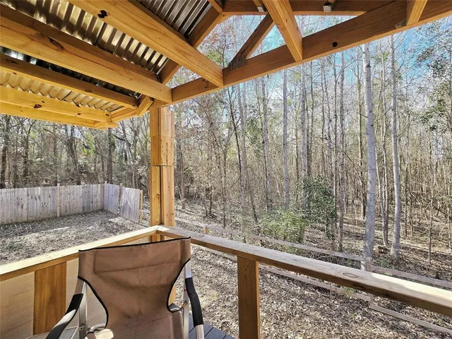 a view of backyard with tub and outdoor space