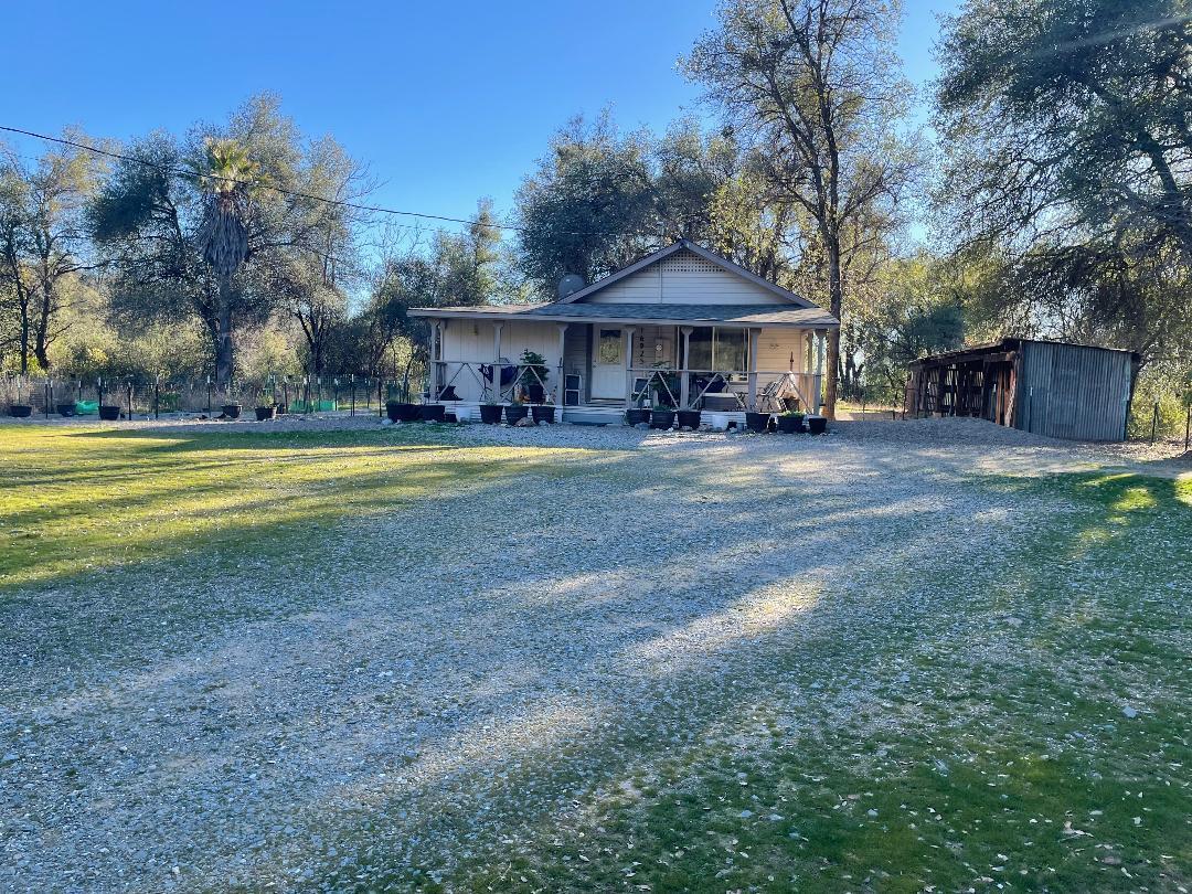a front view of a house with swimming pool having outdoor seating