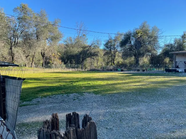 a view of a golf course with a house