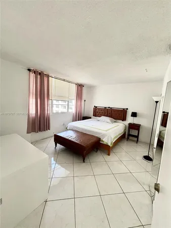 a bedroom with a bed and a window in it