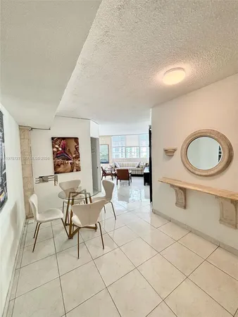 a living room with furniture a air conditioner and a window