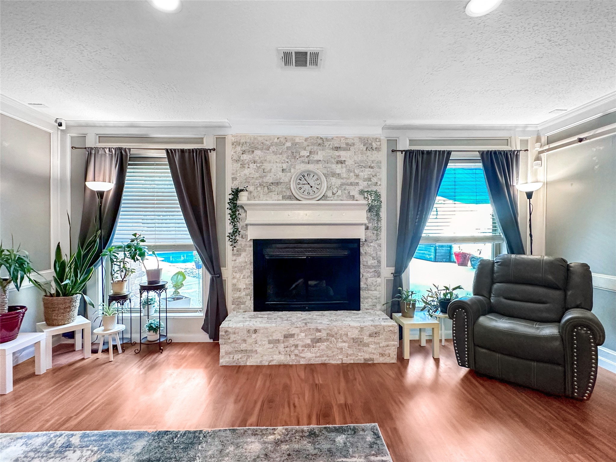 6511 Castle Pine Lane Spring, TX 77379 - Photo 22 of 49 Updated fireplace is a focal point of the living room with crisp finishes and a cozy ambiance that creates the perfect setting for relaxing evenings.