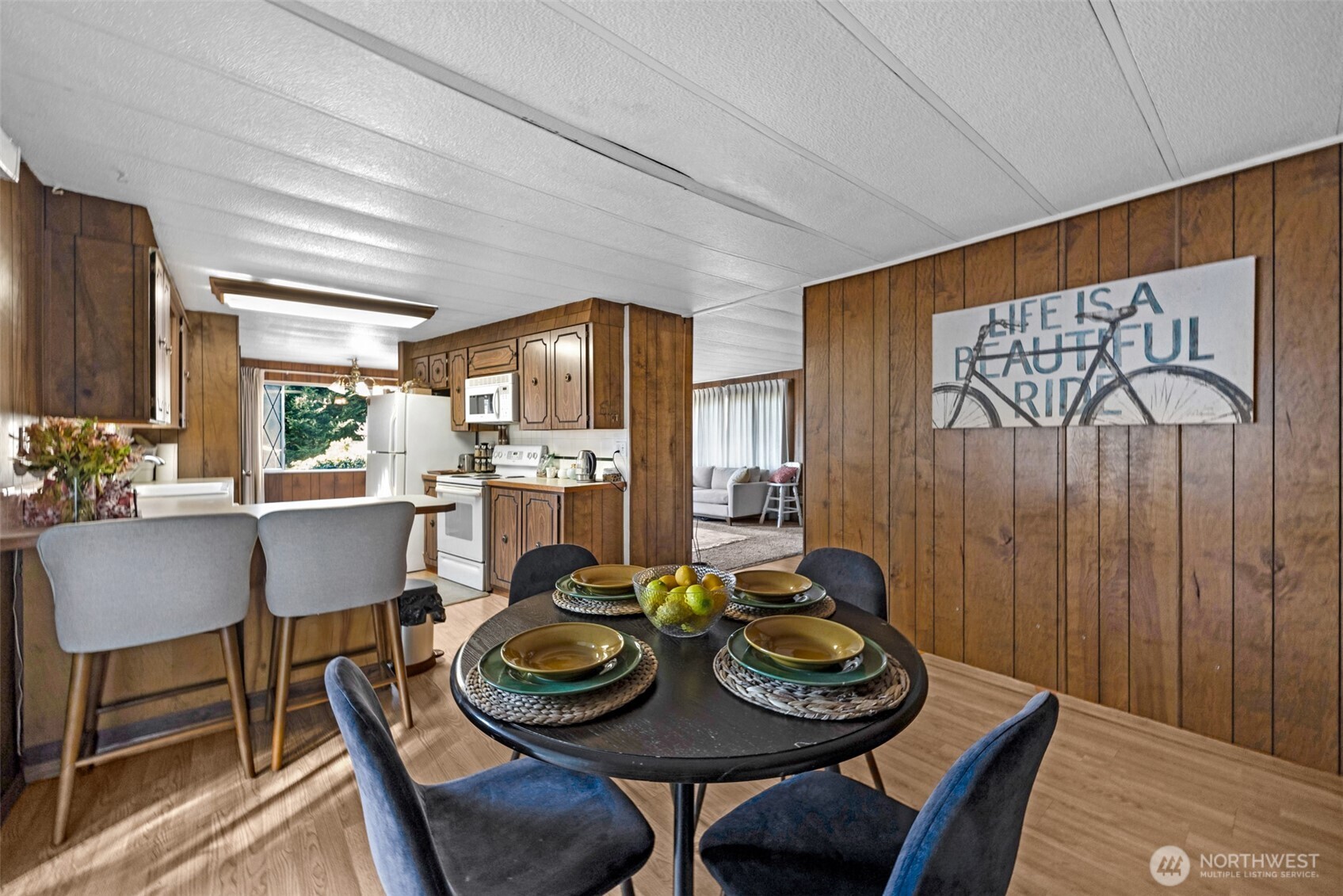 2200 196th Street Southeast, Unit 76 Bothell, WA 98012 - Photo 11 of 27 a view of a dining room with furniture and wooden floor