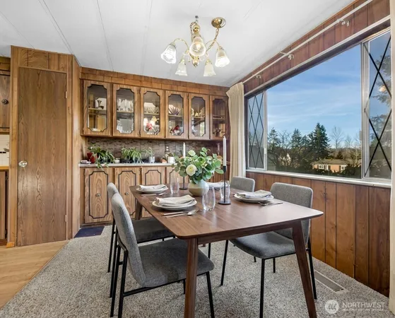 a view of a dining room with furniture window and outside view