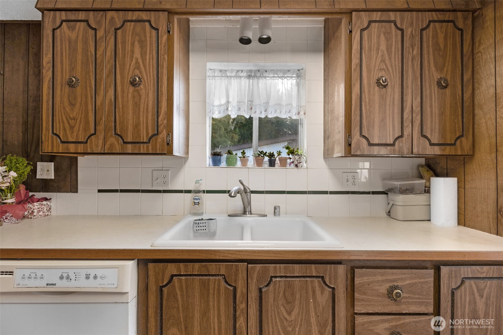 2200 196th Street Southeast, Unit 76 Bothell, WA 98012 - Photo 9 of 27 a kitchen with a sink and a refrigerator