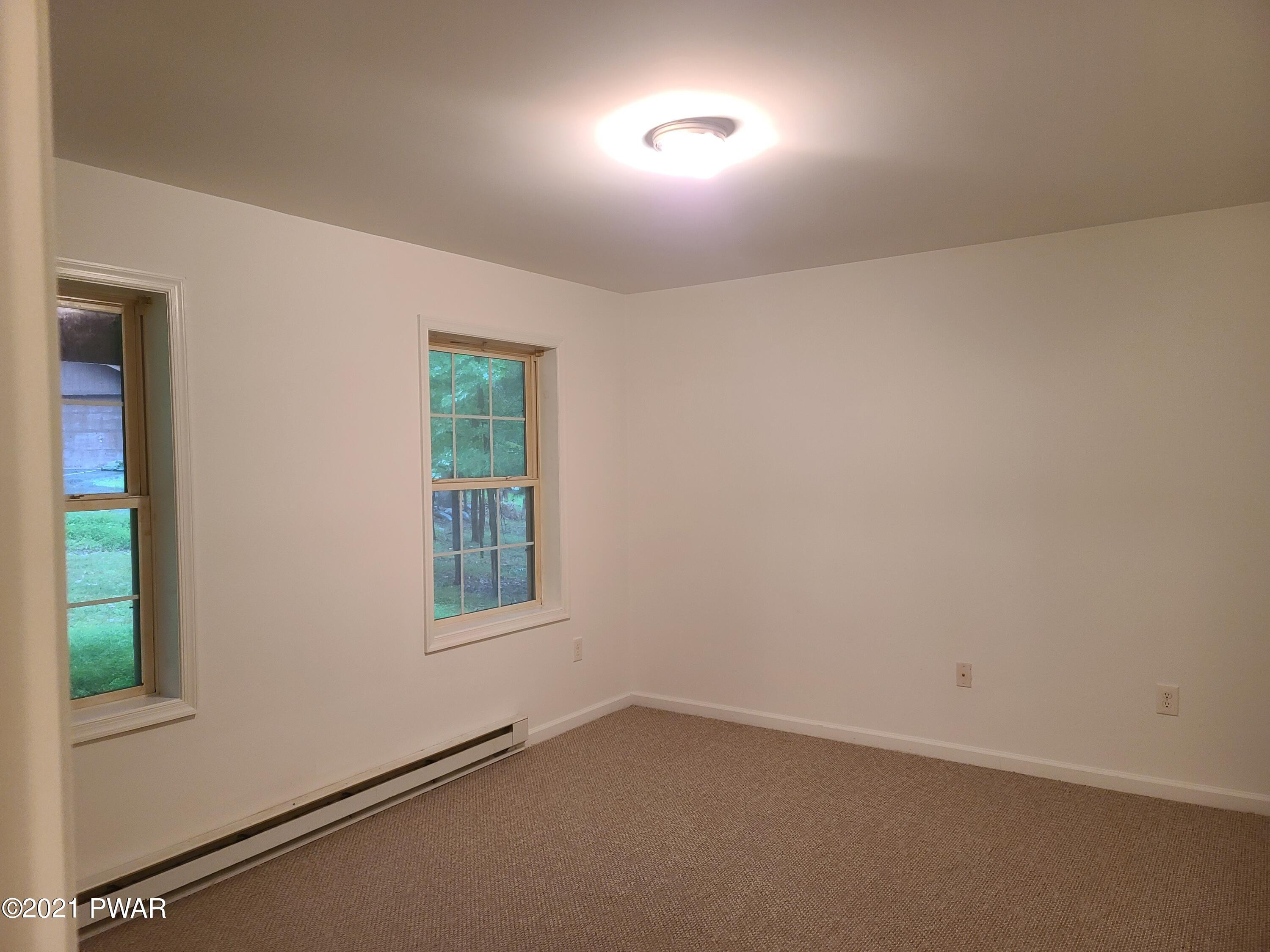 100 Kiel Road Milford, PA 18337 - Photo 19 of 45 an empty room with windows and closet