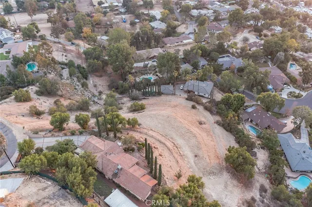 an aerial view of house with yard
