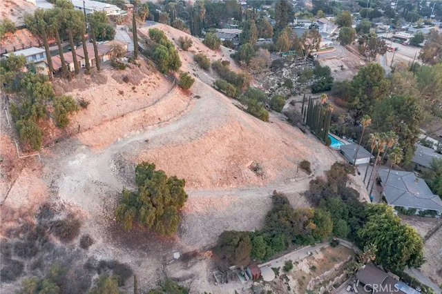 an aerial view of mountain with residential house and mountain view