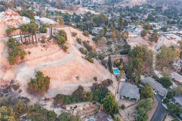 an aerial view of residential house with outdoor space
