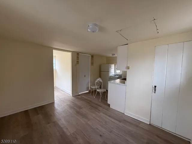 a view of a storage & utility room with wooden floor