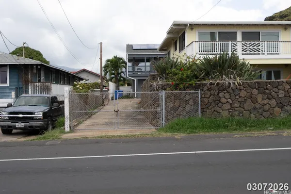 a view of a car park in front of house