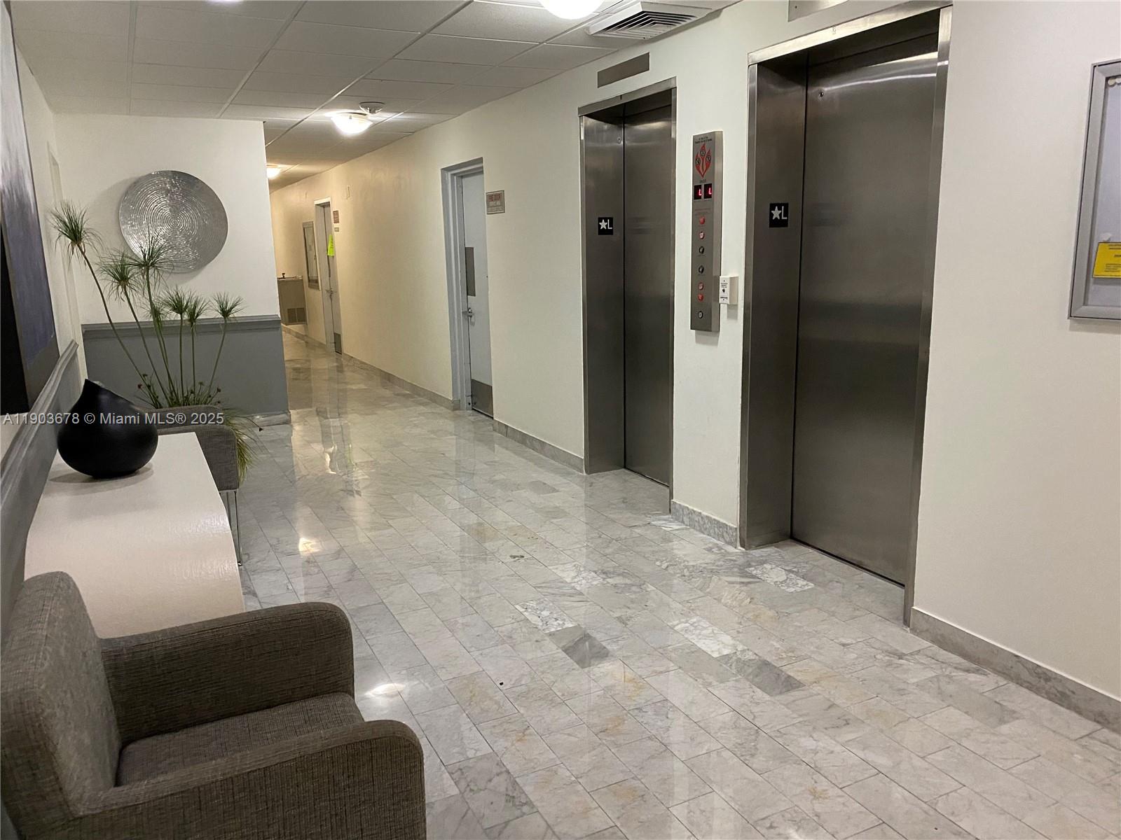 1625 Southeast 10th Avenue, Unit 205 Fort Lauderdale, FL 33316 - Photo 17 of 32 a room with furniture and a mirror