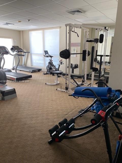 1625 Southeast 10th Avenue, Unit 205 Fort Lauderdale, FL 33316 - Photo 22 of 32 a room with gym equipment and windows