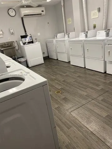 a view of a backyard with plants and lake