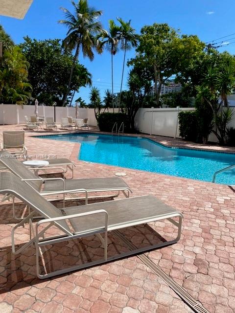 1625 Southeast 10th Avenue, Unit 205 Fort Lauderdale, FL 33316 - Photo 26 of 32 a view of a backyard with plants and lake