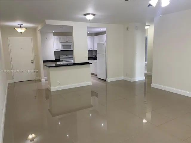 a view of a kitchen with a sink
