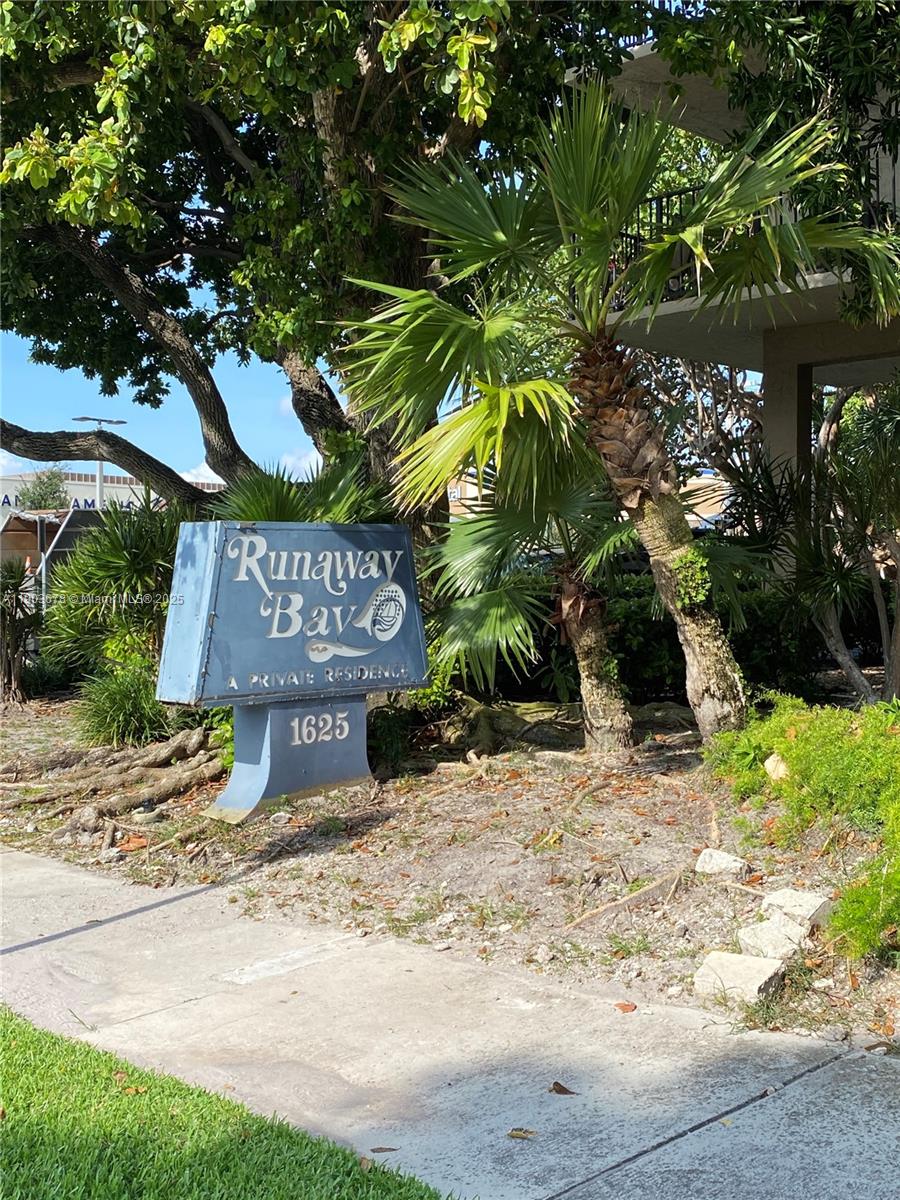1625 Southeast 10th Avenue, Unit 205 Fort Lauderdale, FL 33316 - Photo 32 of 32 a sign that is sitting in front of a tree