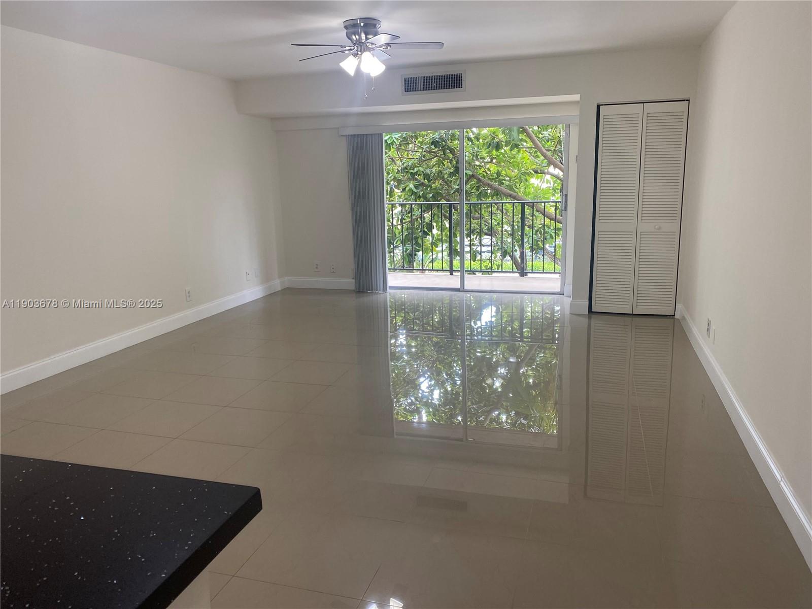 1625 Southeast 10th Avenue, Unit 205 Fort Lauderdale, FL 33316 - Photo 6 of 32 an empty room with a window