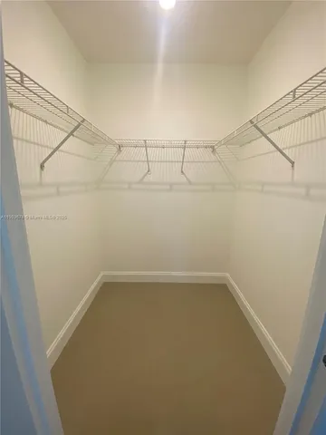 a white toilet sitting next to a bath tub