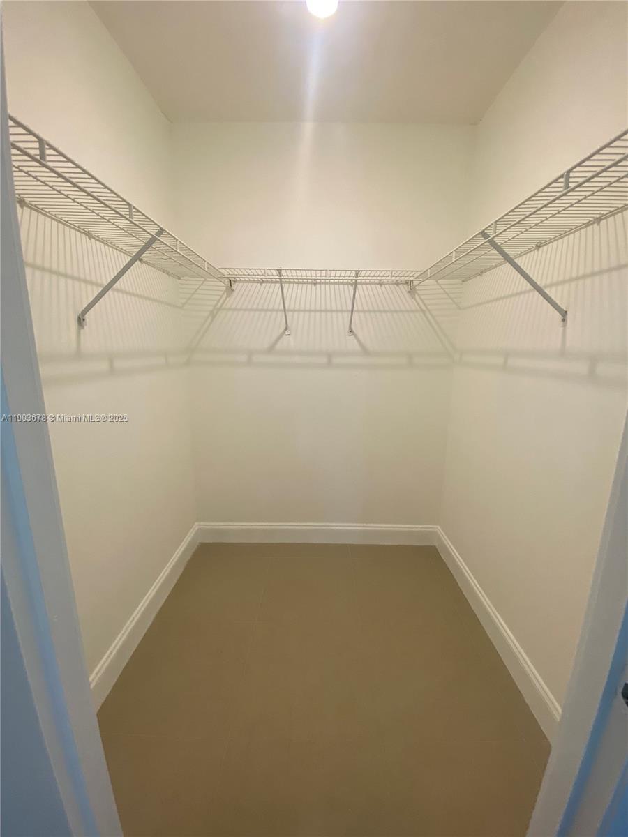 1625 Southeast 10th Avenue, Unit 205 Fort Lauderdale, FL 33316 - Photo 9 of 32 a view of a room with racks on the wall