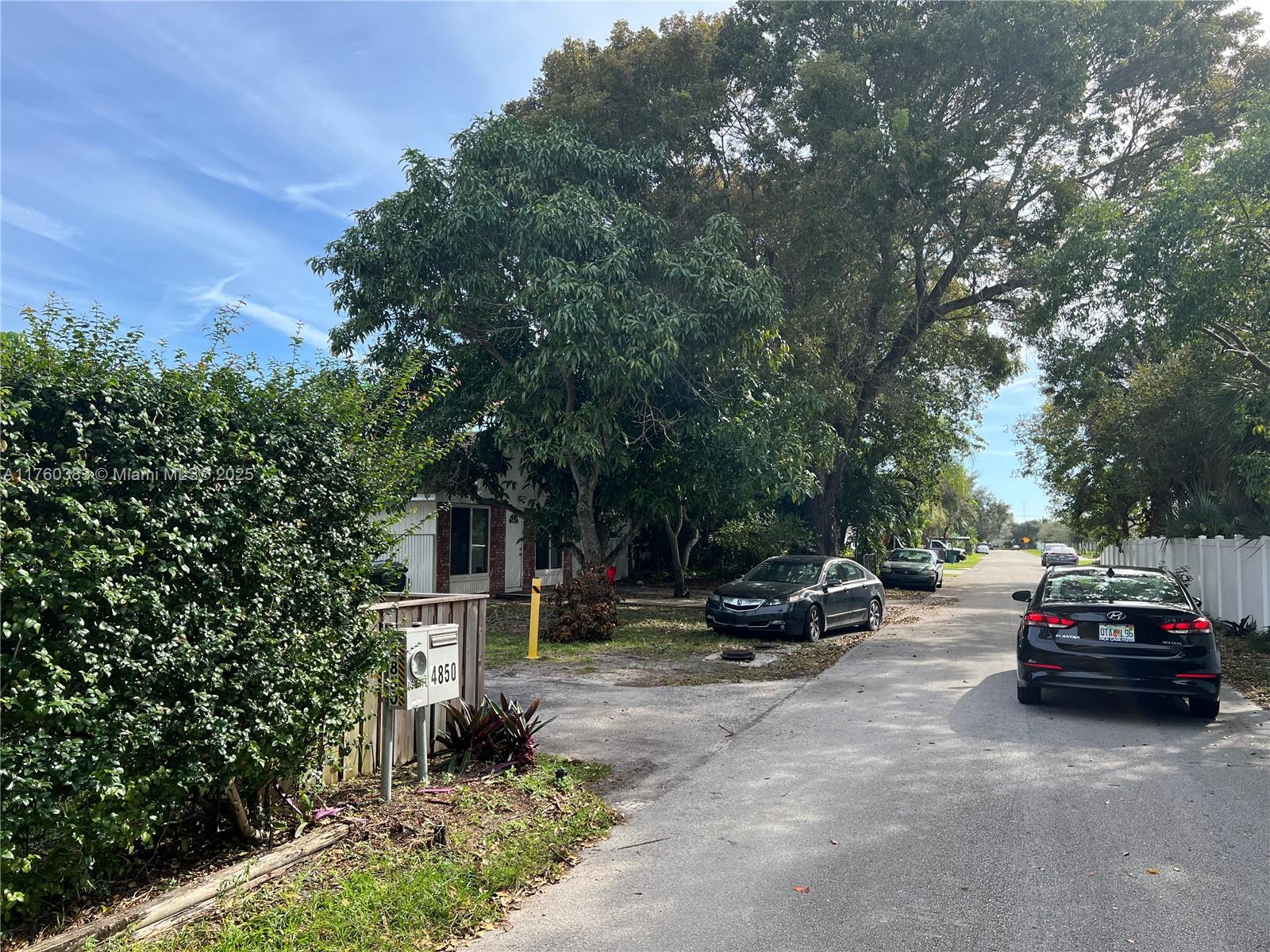 Dania Beach Dania Beach, FL 33312 - Photo 18 of 20 a car parked in front of a house