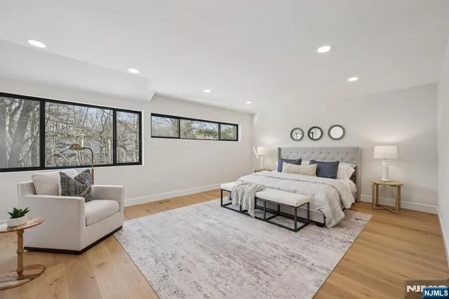 a spacious bedroom with a large bed and a couch