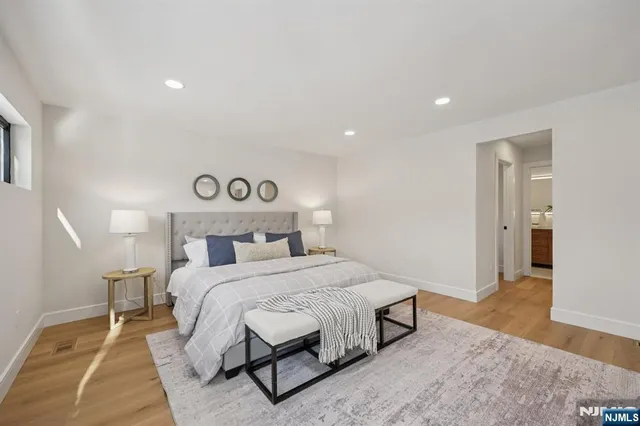 a bedroom with a bed and a rug