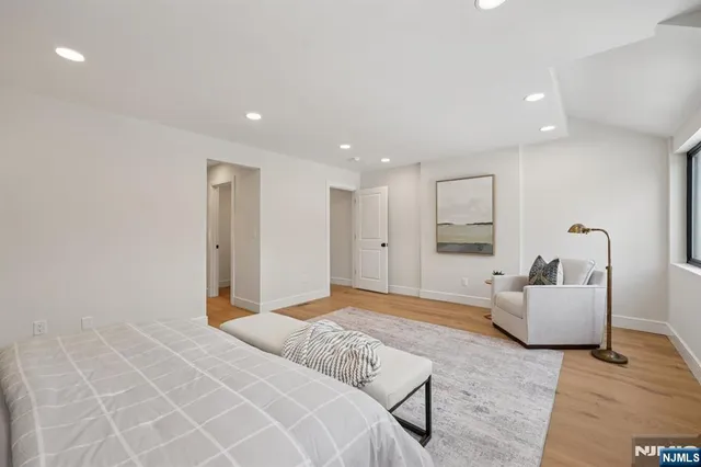 a bedroom with a bed and couch