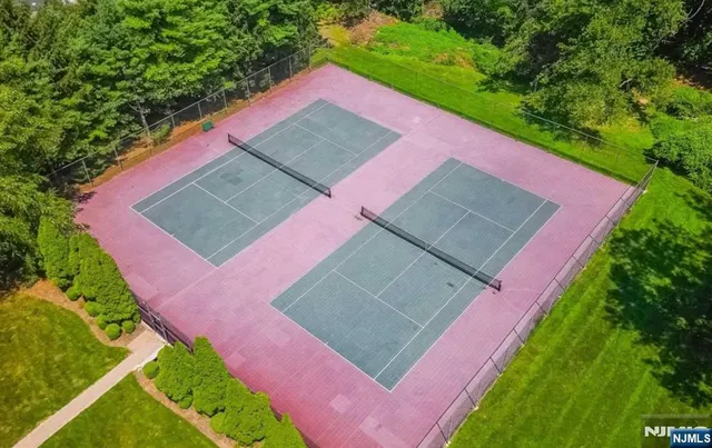 a view of a swimming pool with chairs