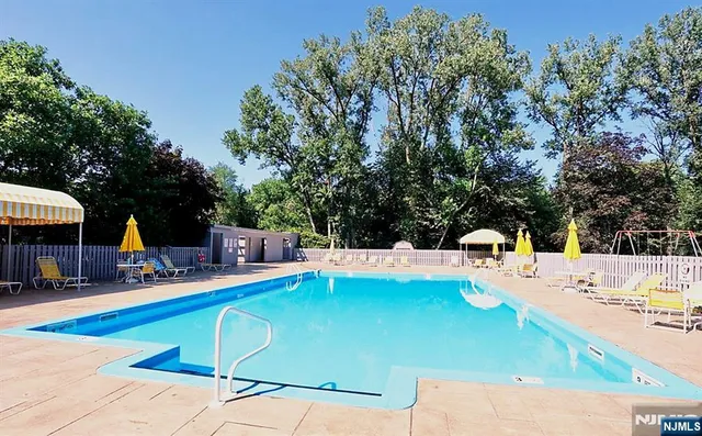 a view of a swimming pool with a patio