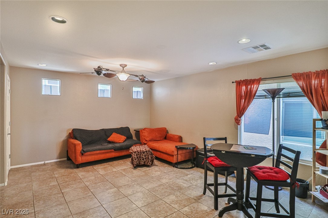 9068 West Alluring Avenue Las Vegas, NV 89149 - Photo 12 of 48 Living room featuring ceiling fan, recessed lighting, and light tile patterned flooring