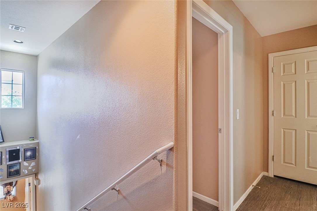 9068 West Alluring Avenue Las Vegas, NV 89149 - Photo 20 of 48 Hallway with baseboards and wood finished floors