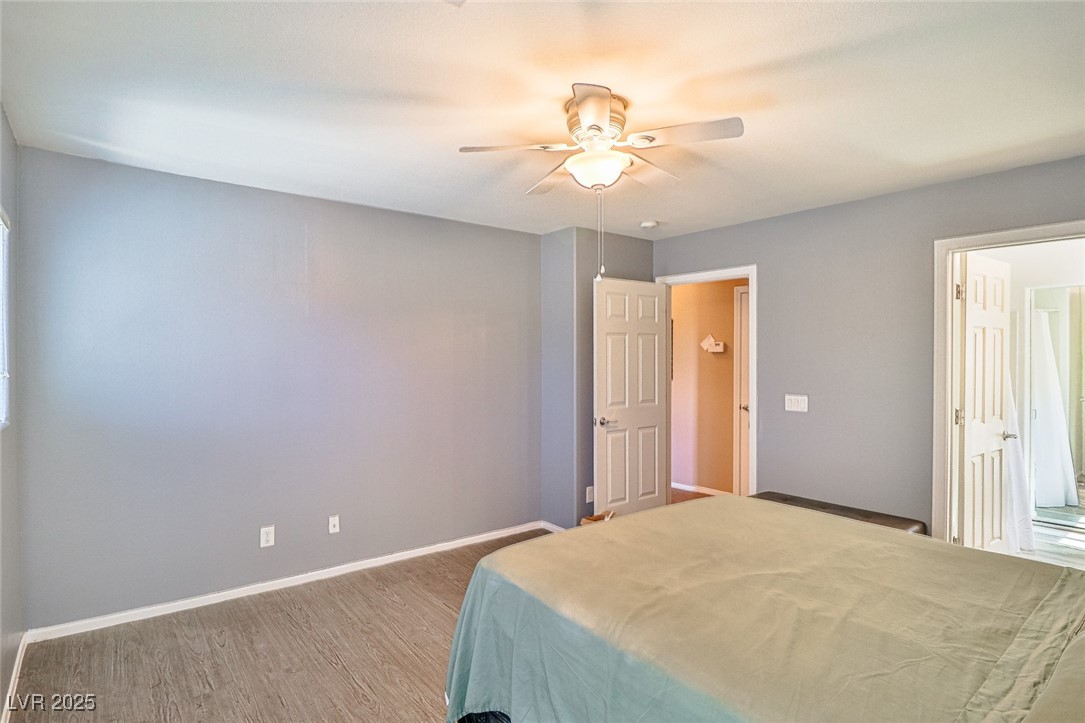 9068 West Alluring Avenue Las Vegas, NV 89149 - Photo 24 of 48 Bedroom featuring wood finished floors and ceiling fan