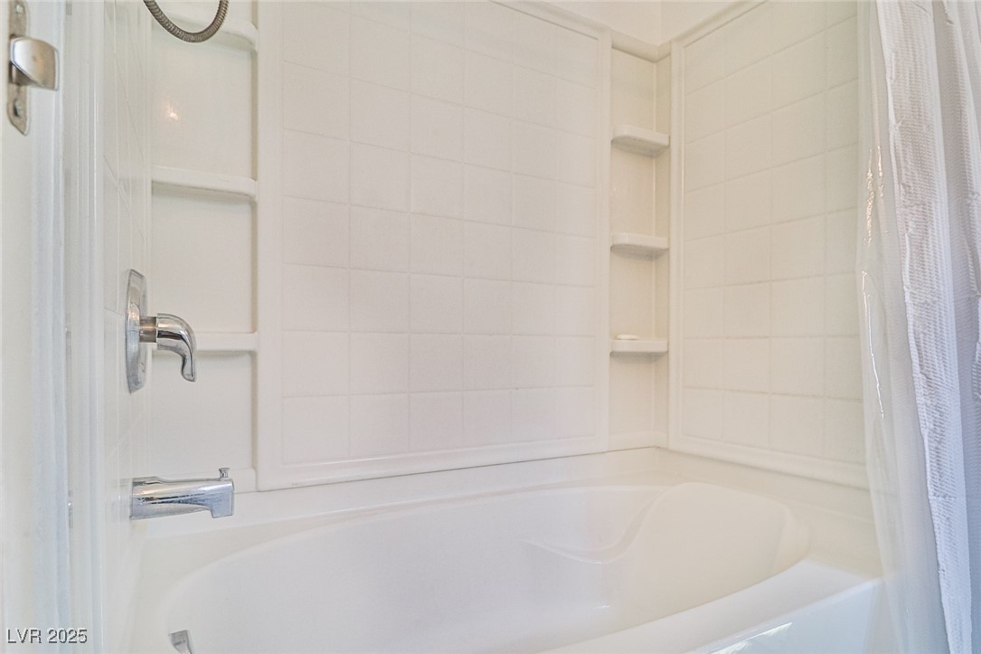 9068 West Alluring Avenue Las Vegas, NV 89149 - Photo 26 of 48 Bathroom with shower / tub combo with curtain