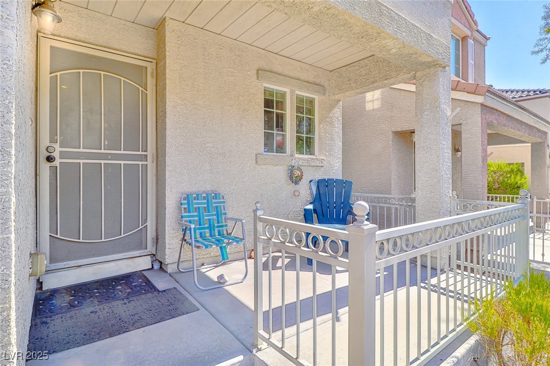 9068 West Alluring Avenue Las Vegas, NV 89149 - Photo 3 of 48 Entrance to property featuring stucco siding