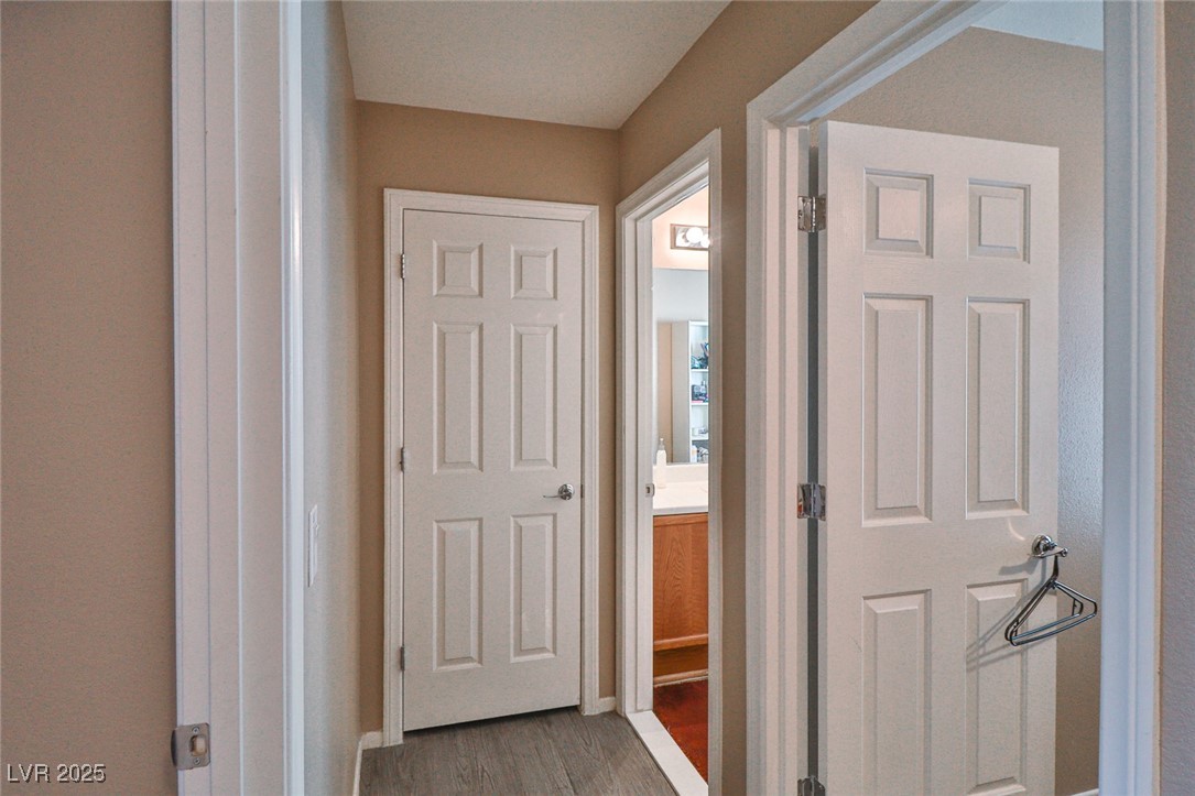 9068 West Alluring Avenue Las Vegas, NV 89149 - Photo 31 of 48 Hallway with wood finished floors and baseboards