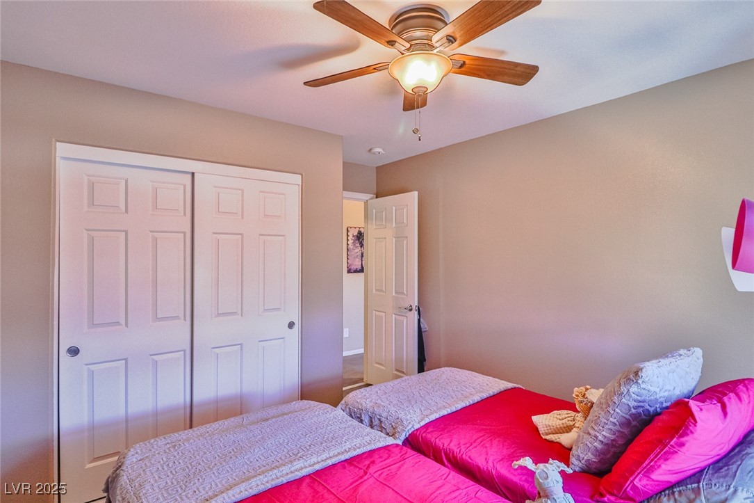 9068 West Alluring Avenue Las Vegas, NV 89149 - Photo 36 of 48 Bedroom with a closet and ceiling fan