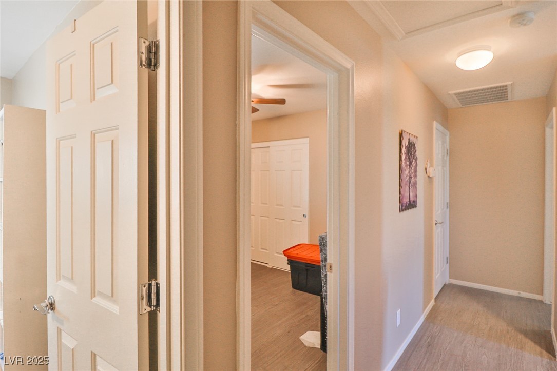 9068 West Alluring Avenue Las Vegas, NV 89149 - Photo 39 of 48 Hallway with wood finished floors and baseboards