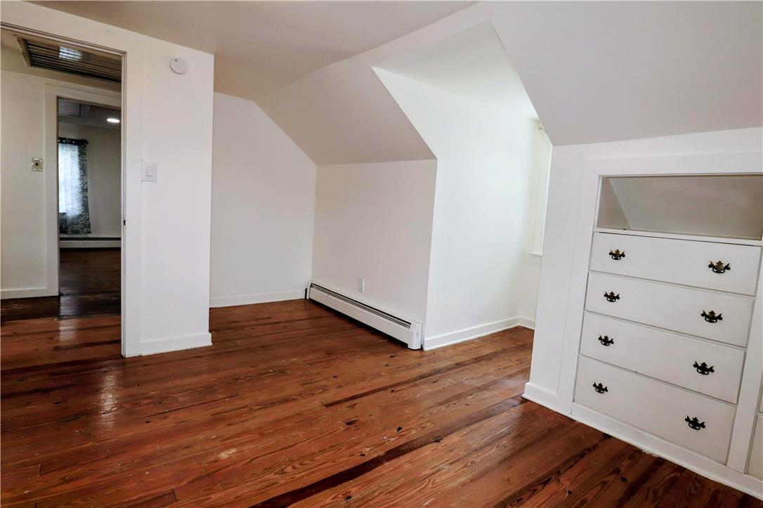 172 Harrison Street Emmaus, PA 18049 - Photo 15 of 30 Sloped ceilings and hardwood floors define this bedroom space, offering versatile living options.