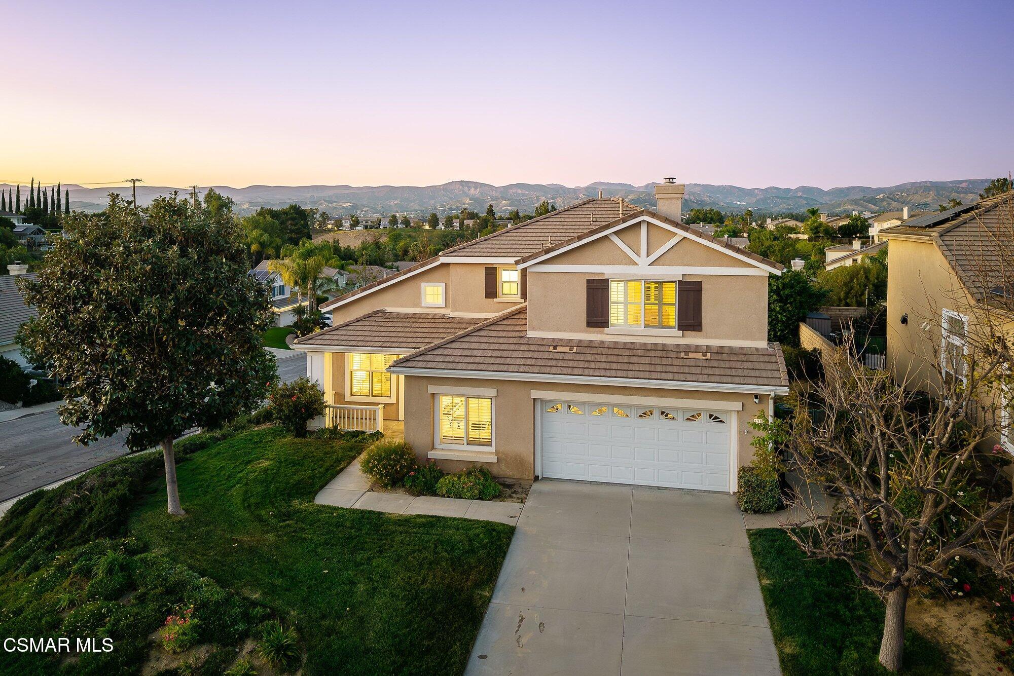 3205 Pine View Drive Simi Valley, CA 93065 - Photo 2 of 72 a front view of a house with a yard and garage