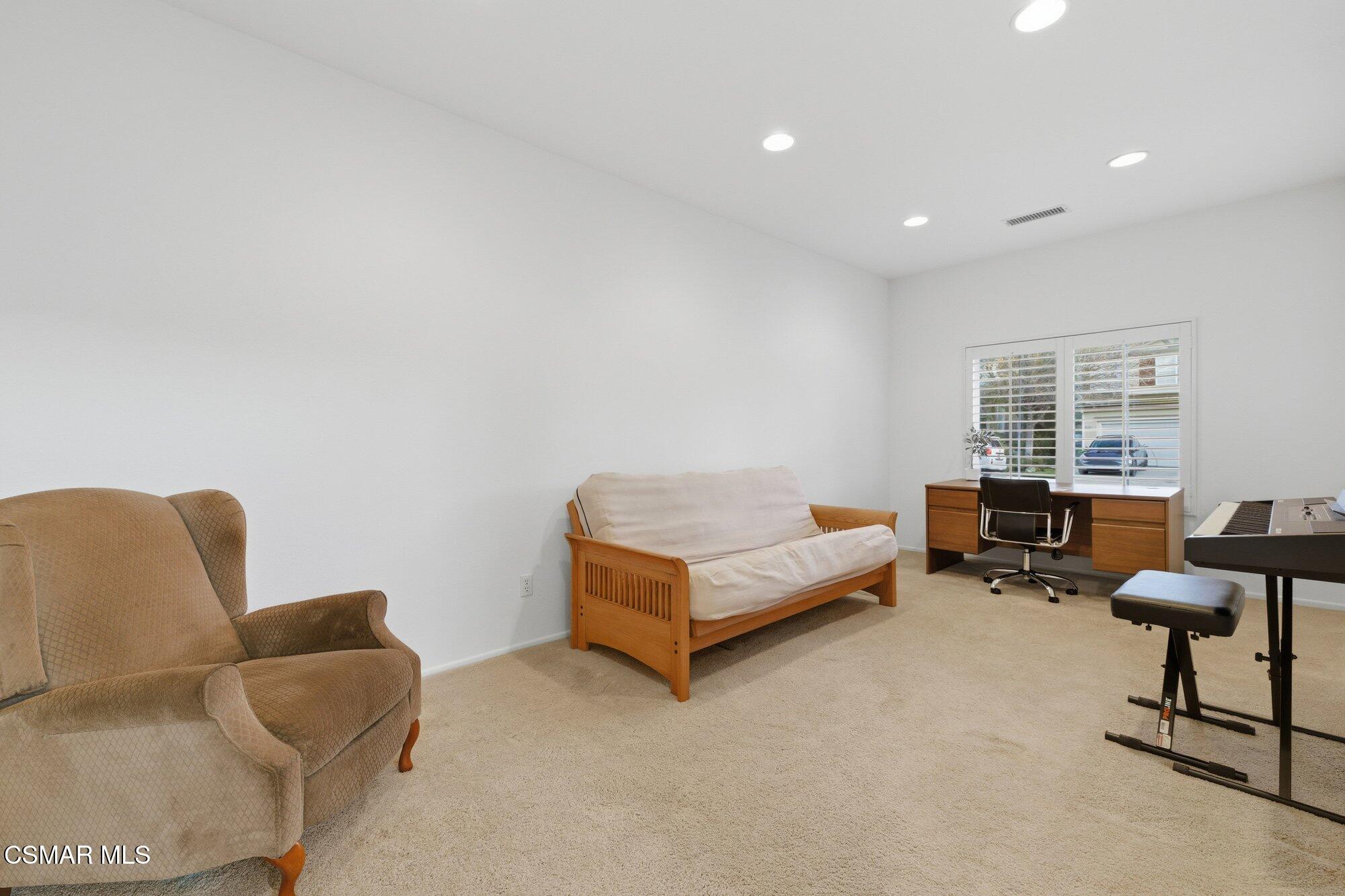 3205 Pine View Drive Simi Valley, CA 93065 - Photo 22 of 72 a living room with furniture and a window