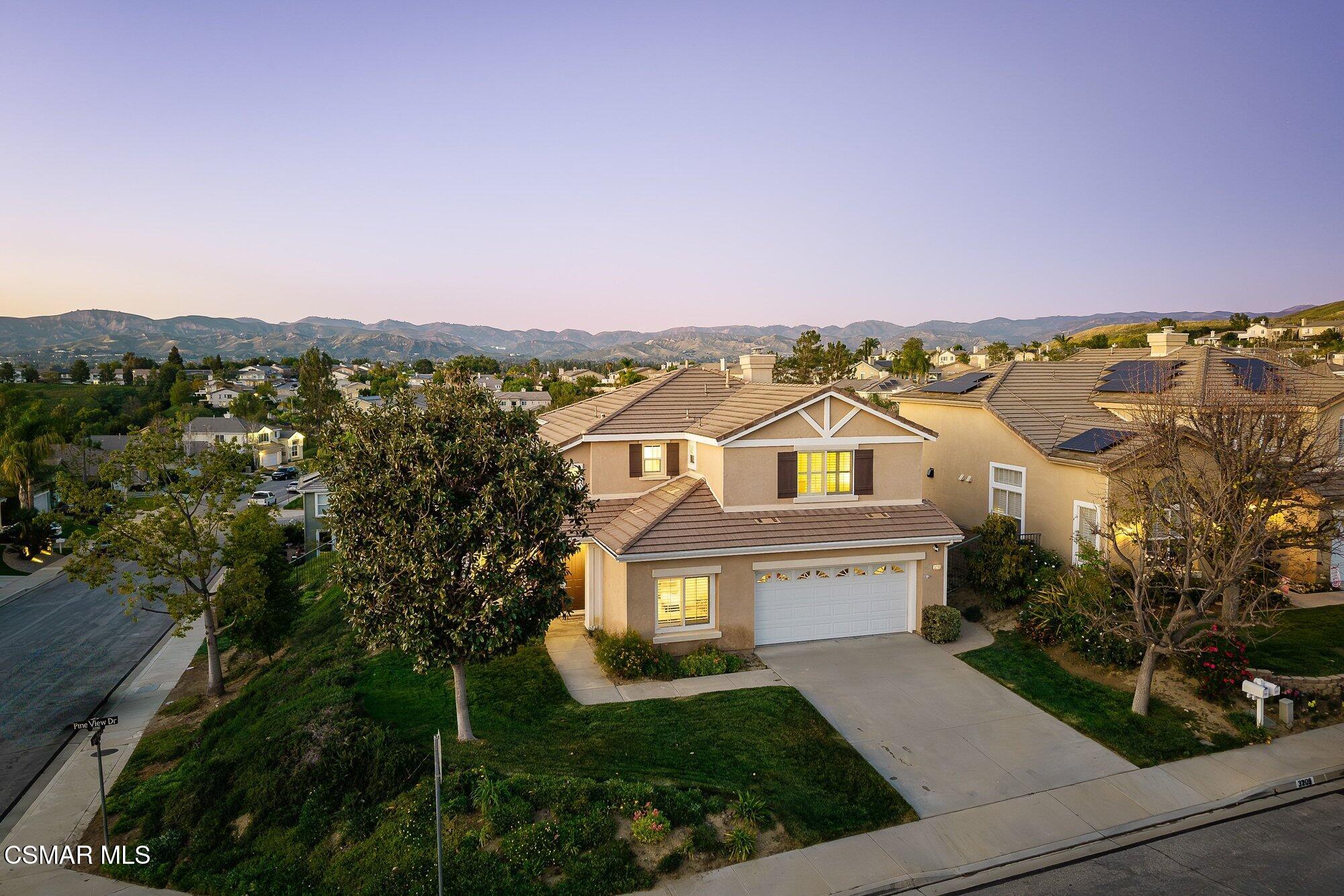 3205 Pine View Drive Simi Valley, CA 93065 - Photo 3 of 72 a view of a white house with a big yard and large tree