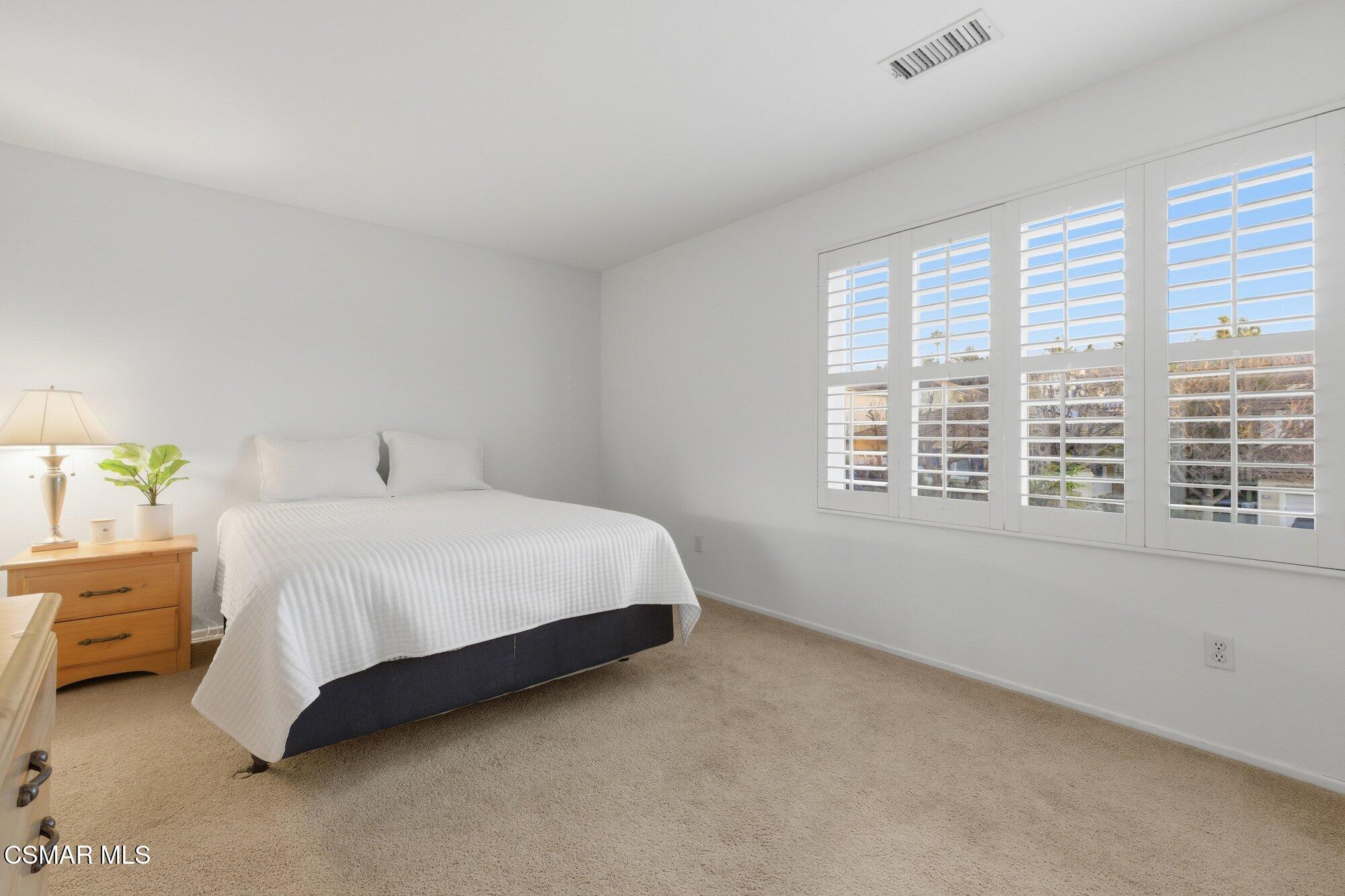 3205 Pine View Drive Simi Valley, CA 93065 - Photo 31 of 72 a spacious bedroom with a bed and a window